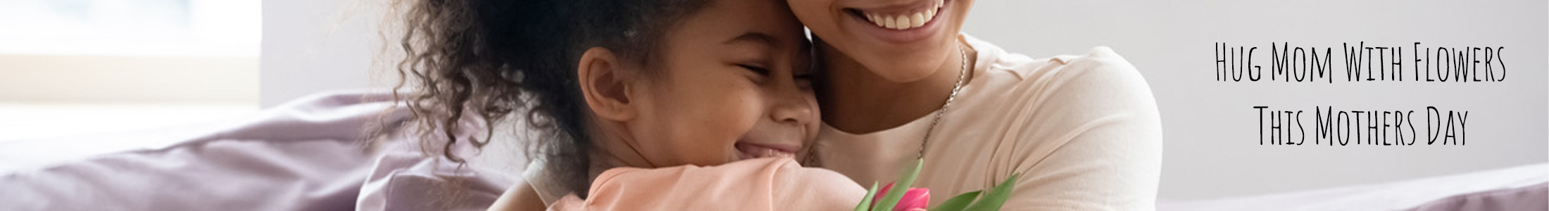 daughter hugging mom with flowers